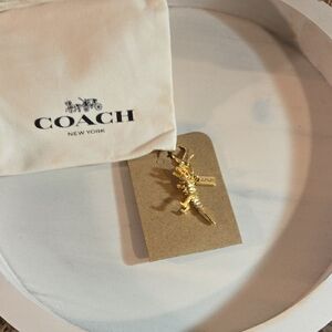 Coach Metallic Gold Dinosaur Charm Bag Included